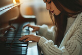 Beautiful young woman playing the piano
