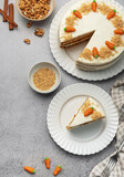 Fototapeta Storczyk - Homemade carrot cake made with walnuts, iced with cream cheese. Sweet dessert.