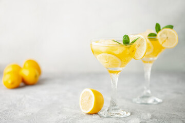 Wall Mural - Summer limoncello margarita cocktail with lemons and mint in a glass