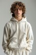 © yevgeniya131988 - Model Poses in Oversized Sweatshirt Against White Background