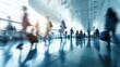© Balerinastock - Busy Airport Terminal with Blurred Motion People