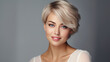 © ALA - Portrait of a beautiful, sexy Caucasian woman with perfect skin and white short hair, on a gray background.