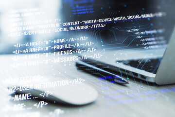 Poster - Image showing a modern laptop with digital code overlay depicting software development concepts in the foreground