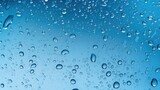 Fototapeta Łazienka - Atmospheric background with water droplets. Monochrome. The texture of water on a blue background.