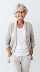 Poster - Stock image of an elderly woman in smart casual clothing against a plain white background Generative AI