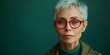 © Iryna - A confident and stylish elderly woman with short hair, wearing eyeglasses, and radiating positive energy.