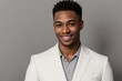© PNG&Background Image - Handsome black man in a white suit smiling and looking at the camera isolated on a grey background with copy space.