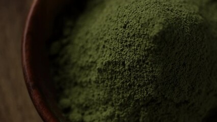 Poster - Matcha green tea powder in wooden bowl, top view