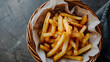 Homemade fried potato or French Fries in basket.