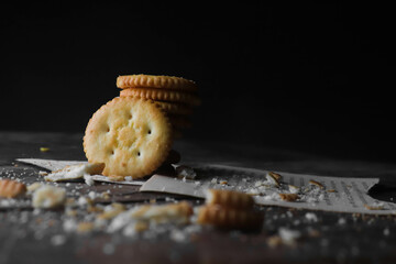 Cookies kept on a wooden table on a dark background