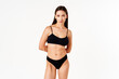 © GVS - Beautiful sensual slim woman in black underwear on white studio background