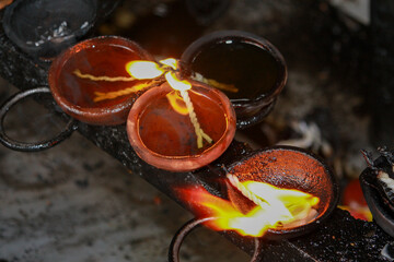 Traditional oil lamps offerings for Buddha, Temple of the Tooth Relic, Kandy, Sri Lanka