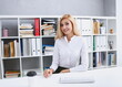 © H_Ko - Beautiful smiling businesswoman portrait at workplace
