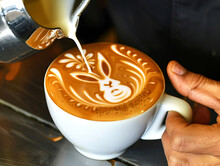 Coffee Latte With Rabbit Art. Skillful Barista Pouring Steamed Milk, Creating A Cozy Atmosphere. Perfect For Coffee Shops, Cafes, And Beverage Advertising.