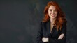 © steve - Portrait of successful redhead woman in business suit, arms crossed and smiling. Success. Goals. Achievement. Room for copy space.