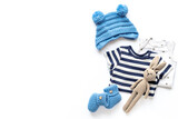 Fototapeta Dziecięca - Set of baby boy dress - blue bodysuit with knitted hat and boots, top view. Kids clothing flat lay