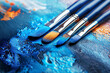 Paintbrushes on a canvas, blue and orange paint - Generative AI