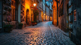 Fototapeta Uliczki - An old cobblestone street in a historic city.