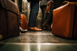 closeup of feet and briefcases in a crowded elevator