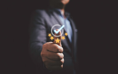 Fototapete - Businessman showing thumb up with correct sign mark and golden five stars on document for the best quality guarantee of product and service concept.