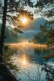 Fototapeta Las - Panoramic Dawn in Wilderness: Calm Lake with Rising Mist, Surrounded by Pine Forest and Mountains, Bathed in the Warmth of Sunlight Through the Trees