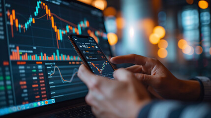 Poster - Close-up of investor hands using smartphone app and laptop to study financial statistics and market trends for trading.