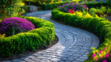 Fototapeta Lawenda - Curved Paving Stone Pathway Amidst Trimmed Hedges and Flower Clusters in a Garden