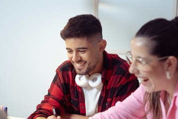 Colleagues smiling in relaxed atmosphere. Concept of work, study, friendship.