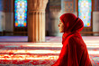 © ADDICTIVE STOCK - Generative AI illustration of Ramadan Kareem, side view A Muslim woman with red clothes is praying in the mosque