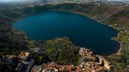 Aerial view of Lake Nemi. It is a small circular volcanic lake in the Alban Hills, near Rome in the Lazio region of Italy. It was formed in an ancient volcanic crater.