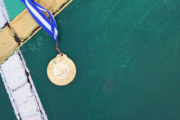 Wall Mural - top view image of medal on asphalt floor