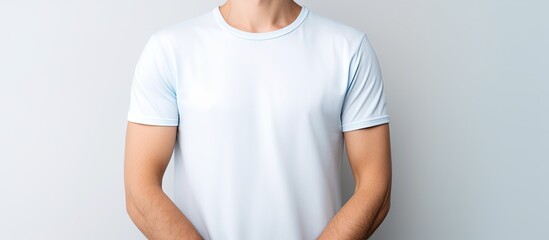 Poster - Confident man poses in crisp white shirt and jeans against blank backdrop