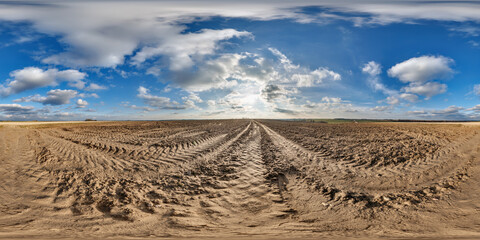 Wall Mural - 360 hdri panorama view on no traffic gravel road among fields in spring day with beautiful clouds in equirectangular full seamless spherical projection, ready for VR AR