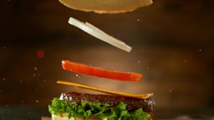 Sticker - Super slow motion of stacking hamburger pieces. Camera in motion. Filmed on high speed cinema camera, 1000 fps. Placed on high speed cine bot. 