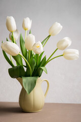 Poster - A bouquet of white tulips in a yellow jug