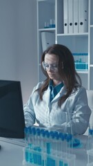 Poster - In this vertical video medical scientist performs blood test for viral and bacterial infections in laboratory using modern diagnostic methods. His research is aimed at detecting and treating diseases.