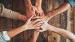 Teamwork: Hände in der Mitte zur Motivation