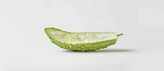 Sticker - A single slice of vibrant green kiwi fruit placed on a clean white background. The juicy flesh and tiny black seeds of the kiwi are visible, creating a simple yet visually appealing contrast.