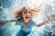 Portrait of cute little girl splashing in water on hot summer day. Concept of having fun, leisure activity, playing in a sea, diving, swimming, summer vacation or happy childhood.
