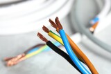 Fototapeta Panele - Colorful electrical wires on blurred background, closeup