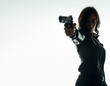 Silhouette of a tough woman holding a gun. Isolated white background with copy space. Private detective. Investigator. Mystery, thriller, action packed pose. Back light.