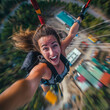 Adventure holiday. Selfie shot during bungee jumping. Ropejumping woman having fun, extreme sports concept, embracing freedom, excitement and adrenaline rush.