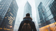 © vvalentine - man in front of a huge skyscraper