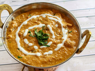 Chicken Korma Masala Gravy with Butter Cream served in karahi isolated on table closeup top view of indian spices food