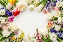 Spring Flowers Frame Made Of Tulips, Daffodils, Crocuses, Hyacinths, Lilacs, Cherry Blossoms, Azaleas On White Background. Top View, Flat Lay, Copy Space In Middle
