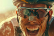 © JR-50 - Close up of a cyclists joyous expression at the moment of winning the race sweat and determination visible on their face the winners medal glinting in the sunlight