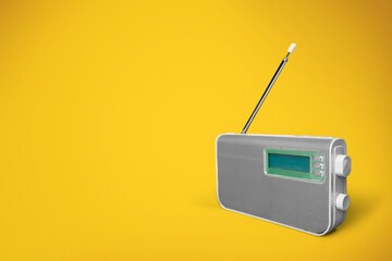 Wall Mural - old radio on yellow background, music