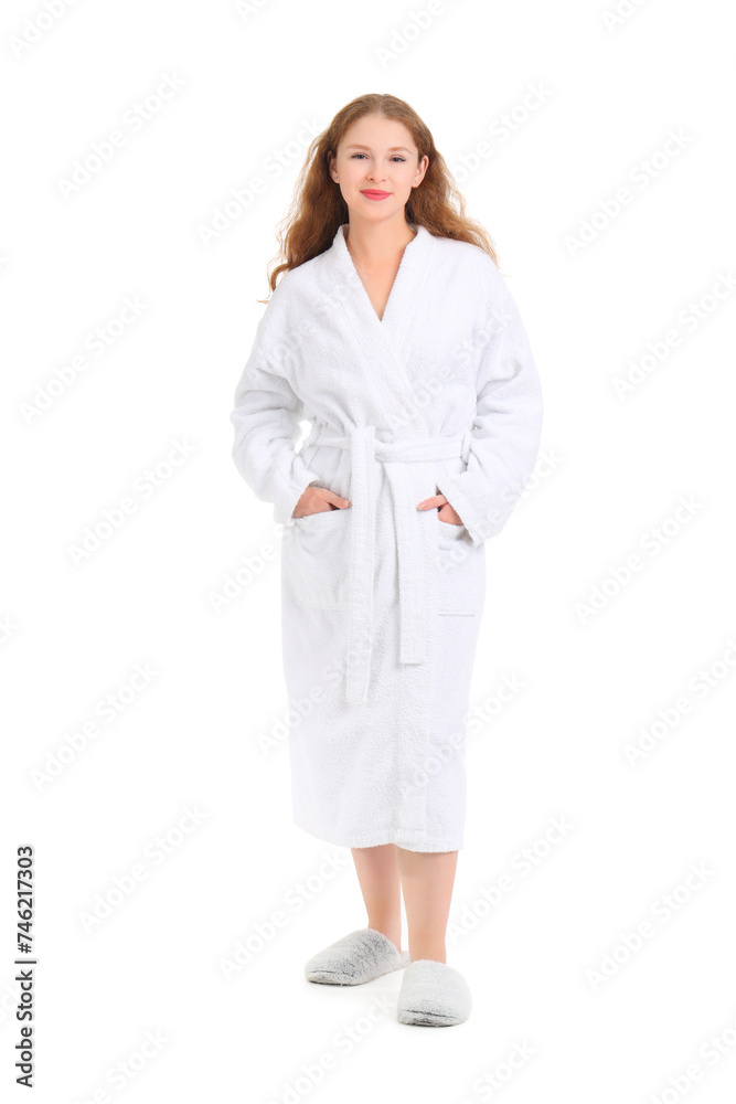 Young woman in bathrobe on white background