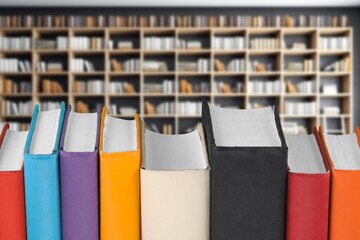 Poster - Books, notebooks lie in library background