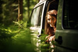 © AspctStyle - Joyful Woman Enjoying Window View on a Road Trip in a Van. Travel Adventure and Happiness Concept